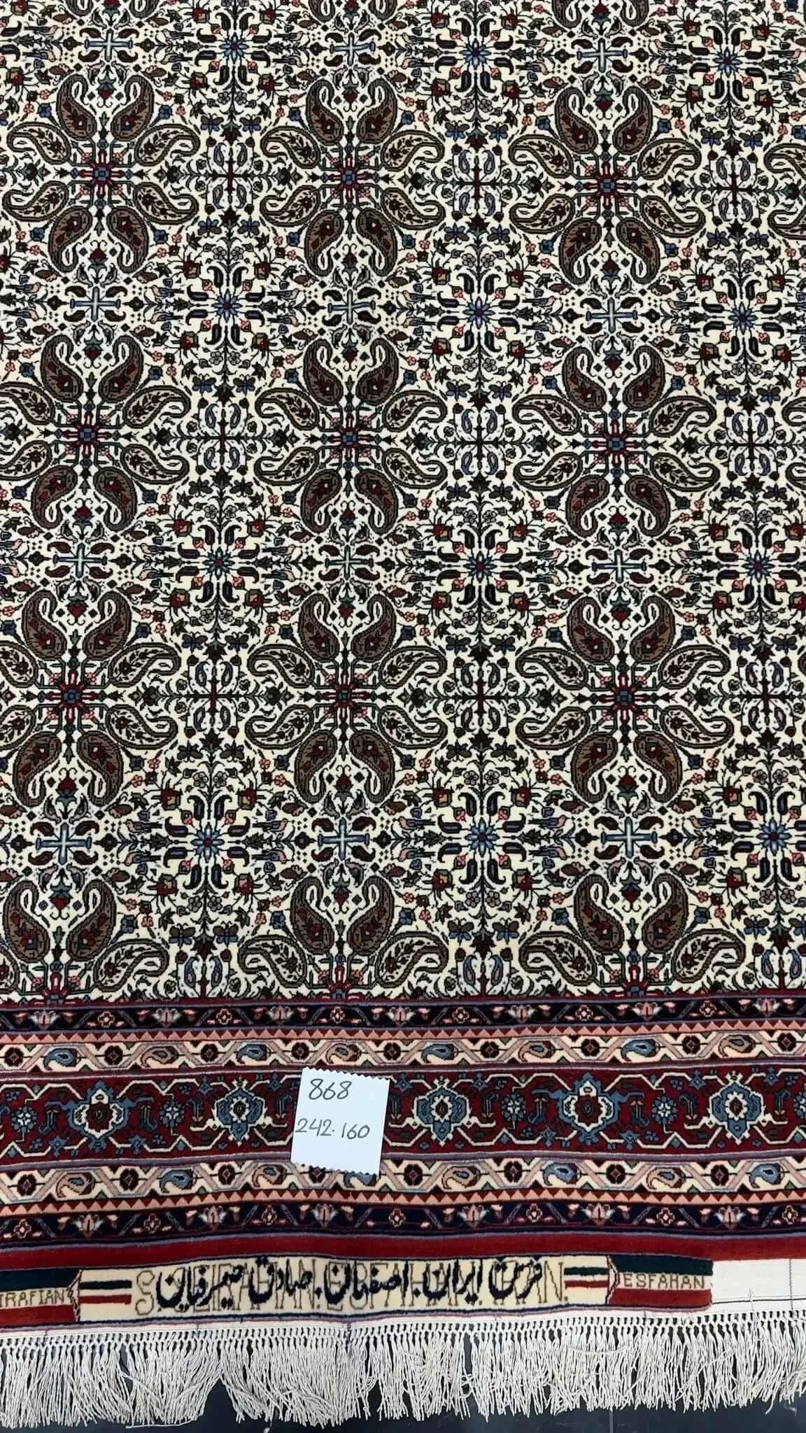 "Vintage Sadegh Seirafian rug with detailed floral designs in traditional Persian style, crafted from wool and silk, perfect for adding luxury to any space."